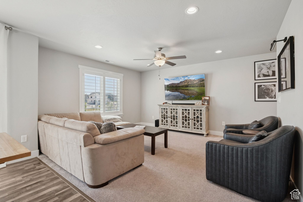 Living area with ceiling fan and recessed lighting