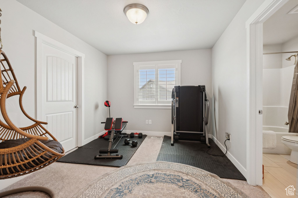 Exercise area featuring baseboards