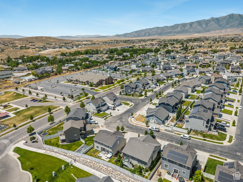 View of property location featuring a mountain backdrop and nearby suburban area
