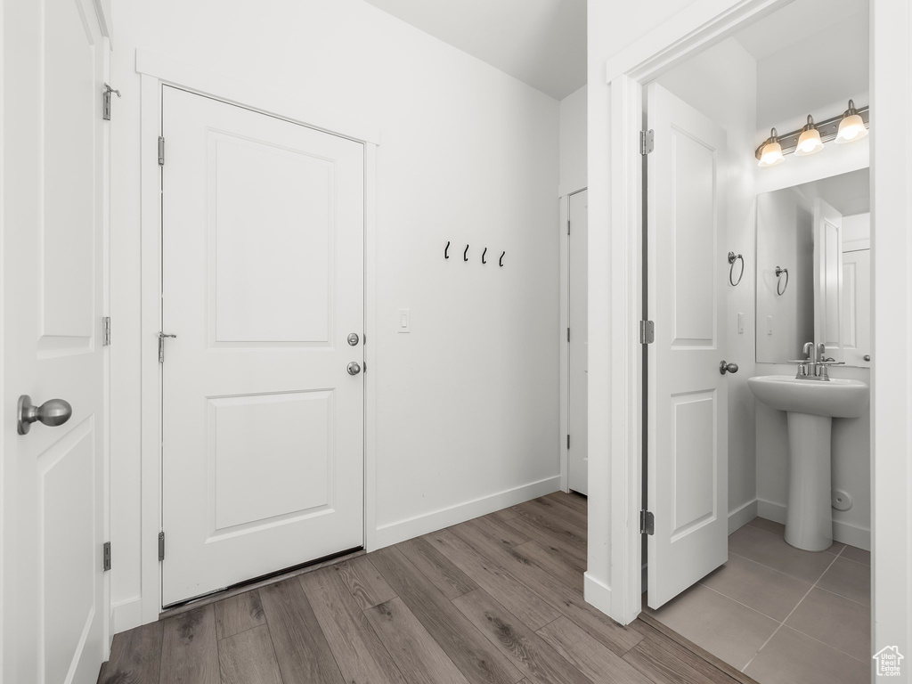 Entryway featuring wood finished floors and baseboards