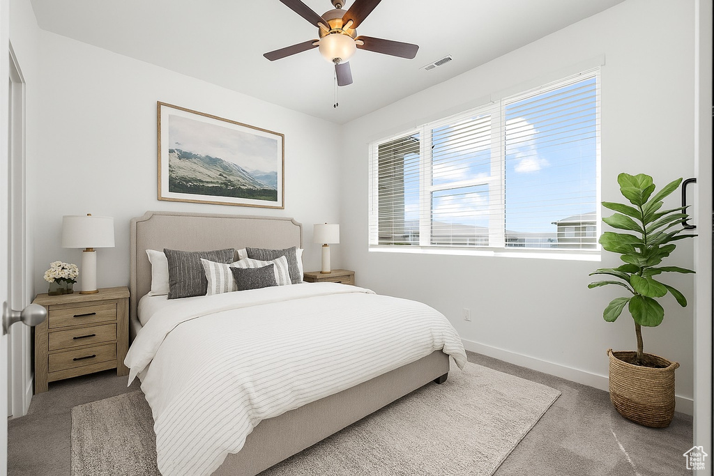 Bedroom featuring carpet and a ceiling fan