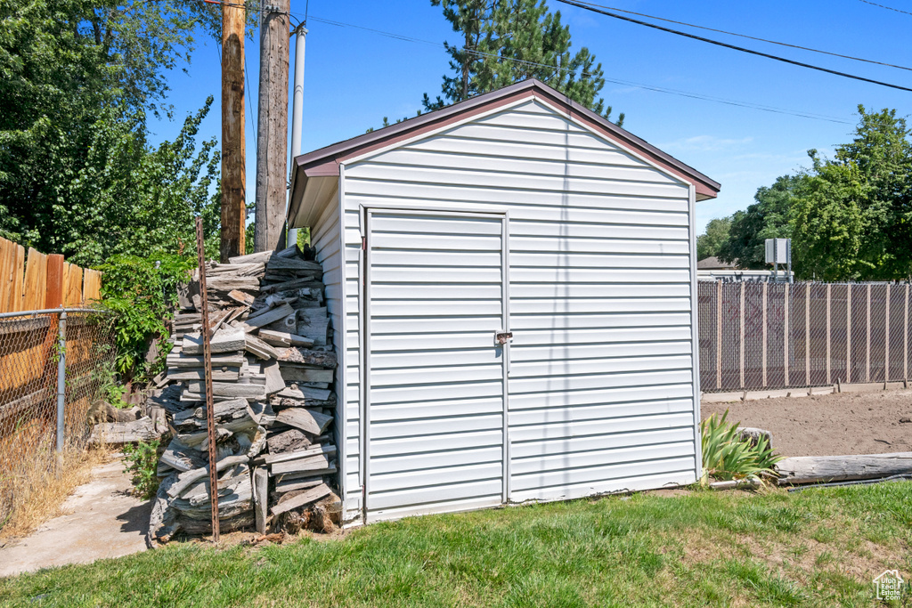 View of shed with a fenced backyard