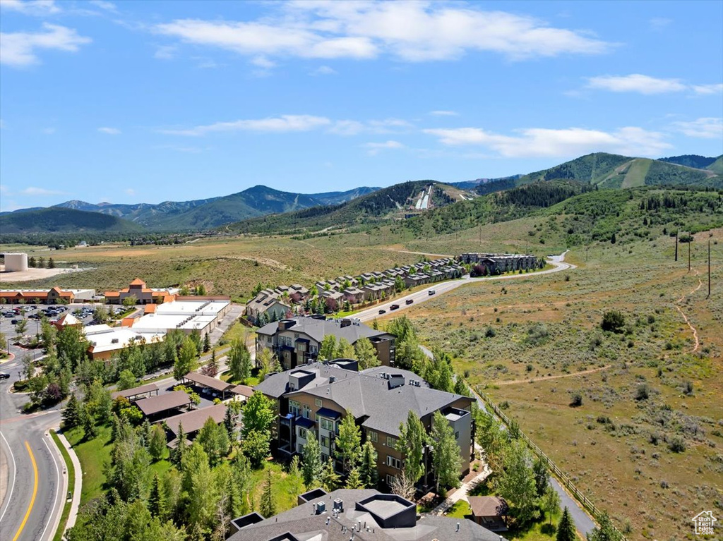 Aerial perspective of suburban area with a mountainous background