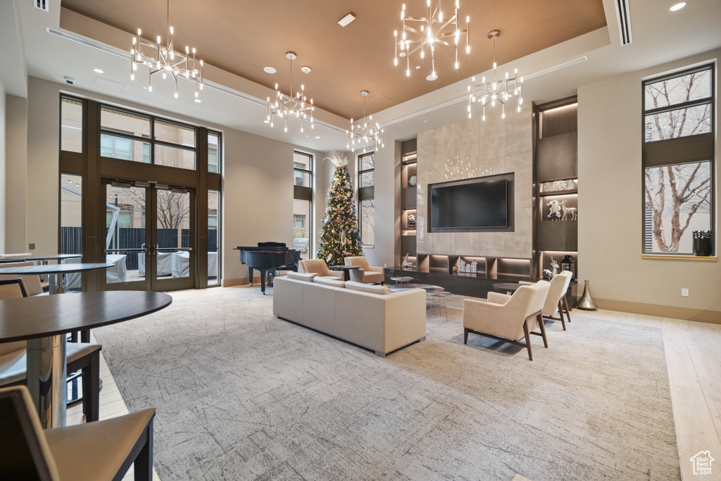 Common area with recessed lighting, a high ceiling, and a security system