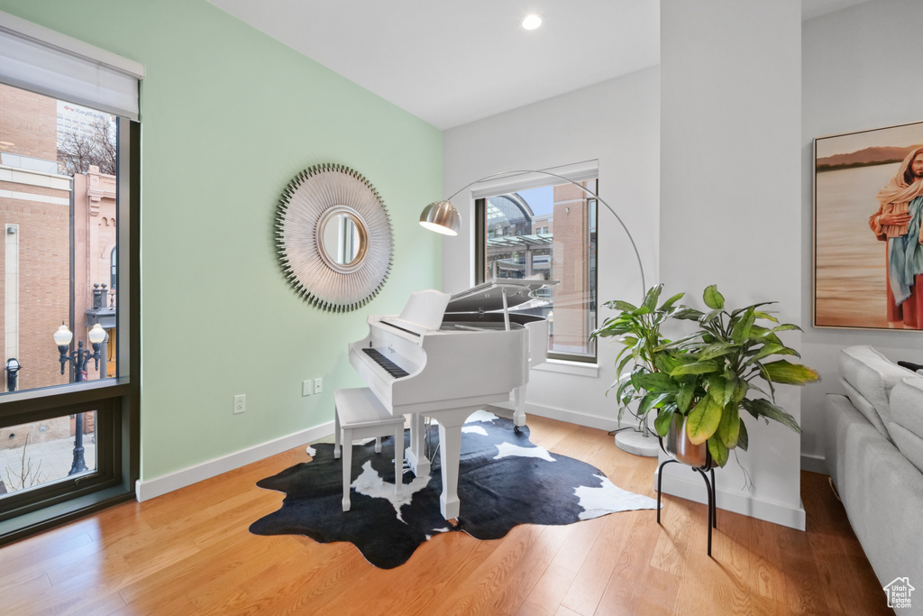 Home office featuring wood finished floors and recessed lighting