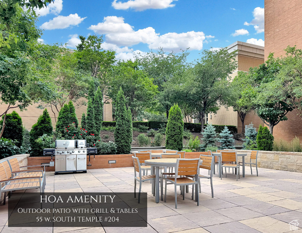 View of patio featuring outdoor dining area and area for grilling