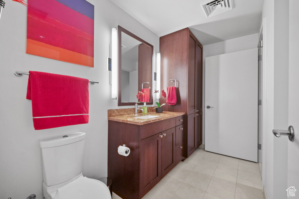 Bathroom with vanity and tile patterned floors