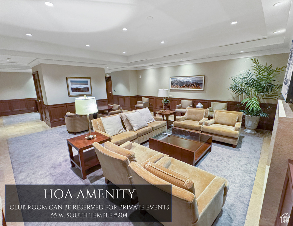 Lobby with a wainscoted wall, recessed lighting, and a decorative wall