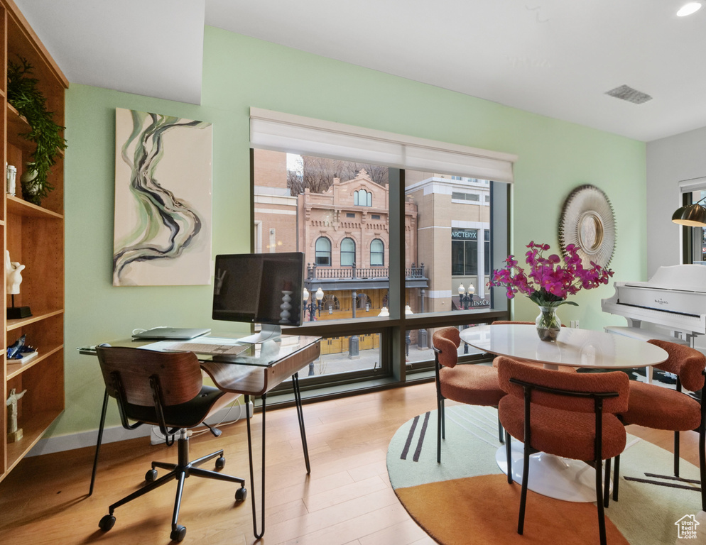 Office area featuring plenty of natural light and wood finished floors