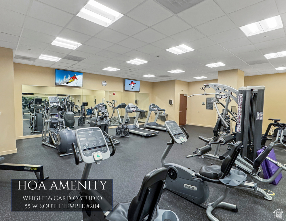 Workout area with a paneled ceiling
