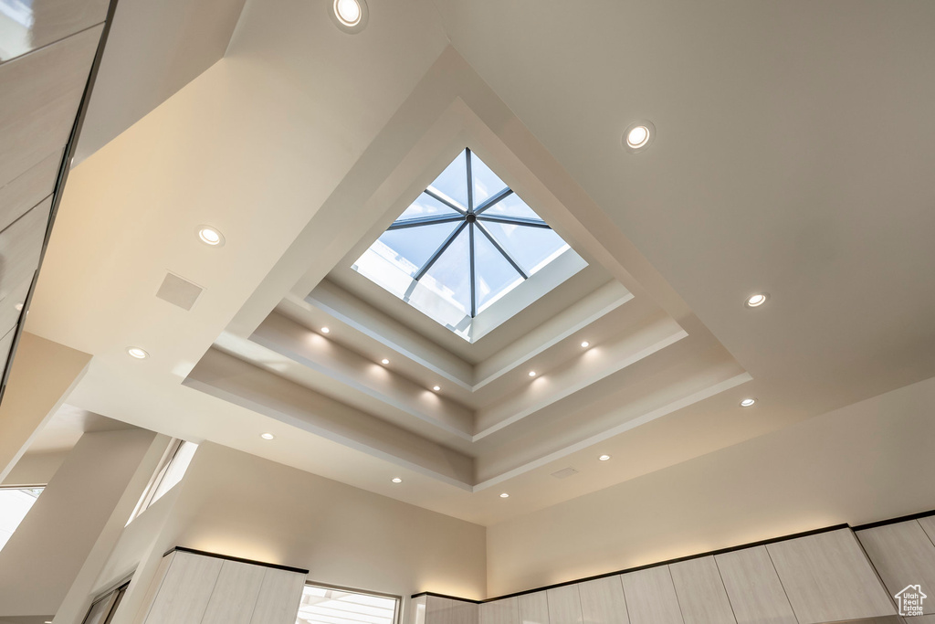 Detailed view of recessed lighting and a raised ceiling