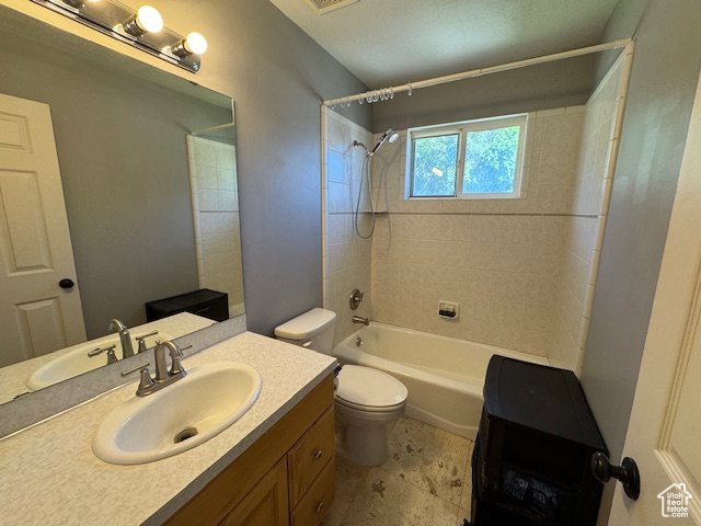 Bathroom featuring vanity and  shower combination