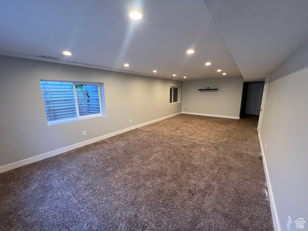 Unfurnished room with recessed lighting and carpet