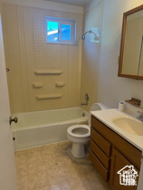 Bathroom featuring vanity and  shower combination