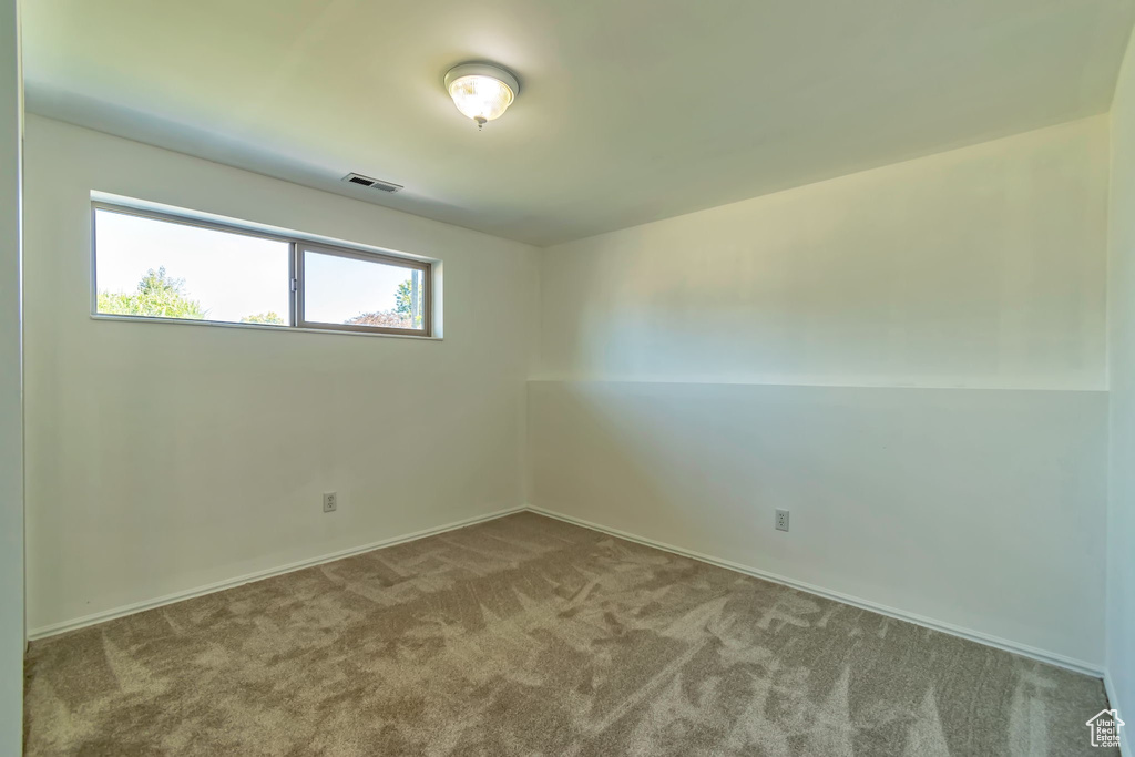 Spare room with carpet floors and baseboards