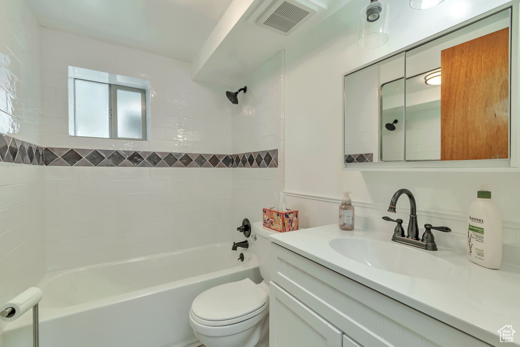 Full bath featuring vanity and tub / shower combination