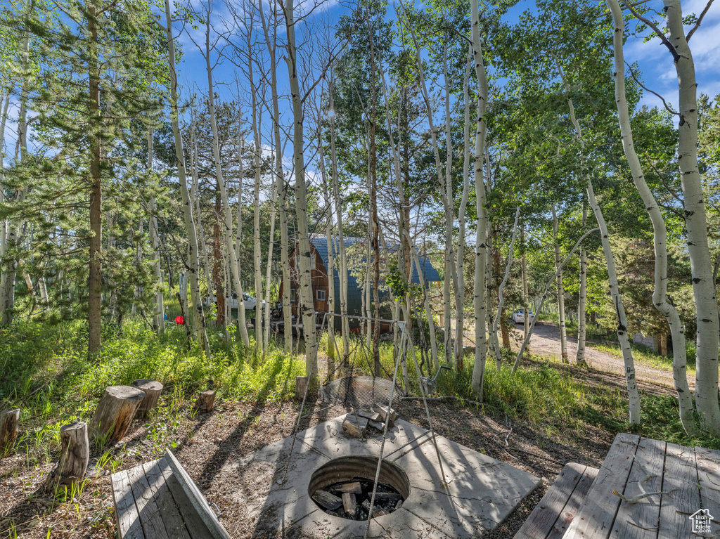 View of yard with a fire pit