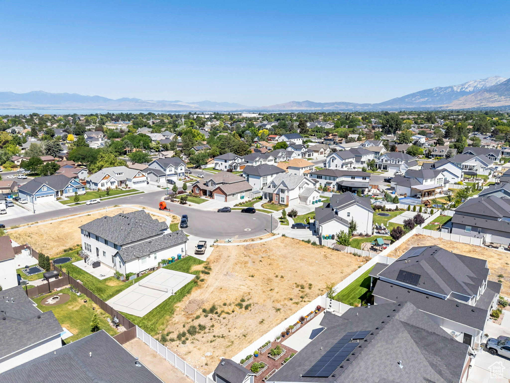 Aerial view of residential area featuring mountains
