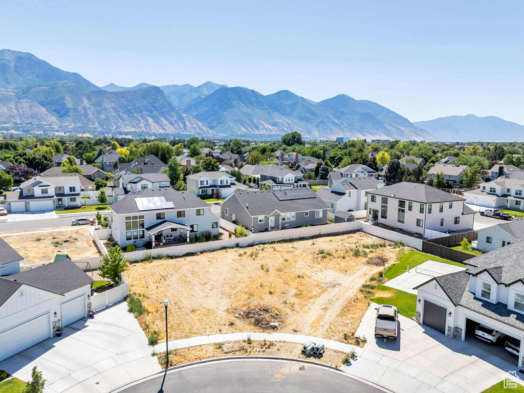 Aerial perspective of suburban area featuring a mountain backdrop