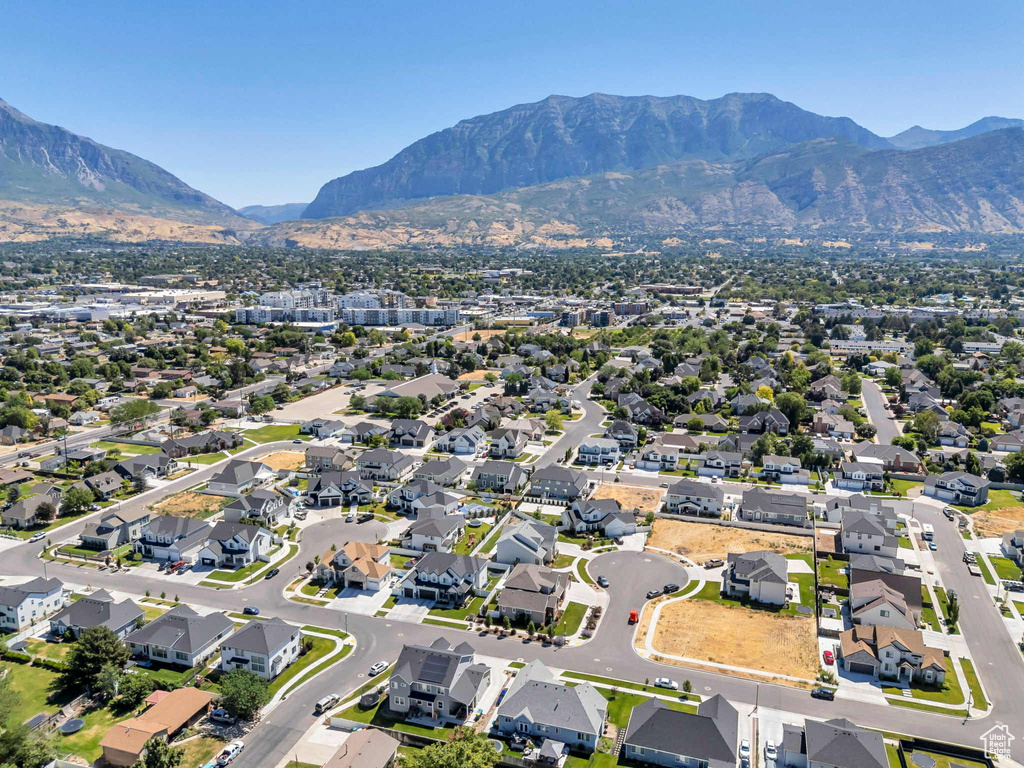 View of property location with a mountain backdrop and nearby suburban area