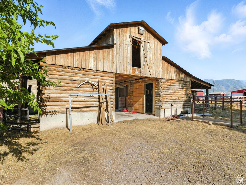 View of barn featuring an exterior structure and a mountain view