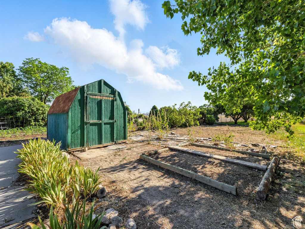 View of shed with a garden