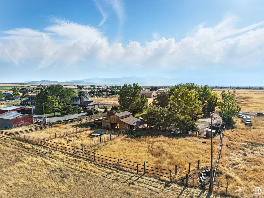 Overview of rural landscape featuring a mountain backdrop