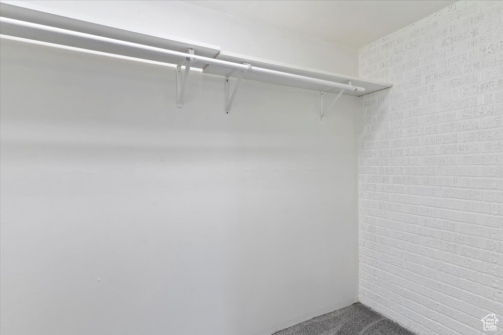 Spacious closet with carpet floors