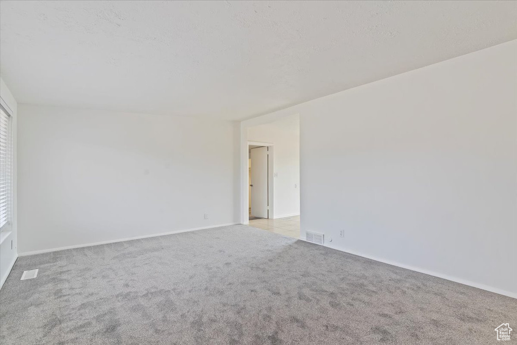 Spare room with carpet flooring and baseboards
