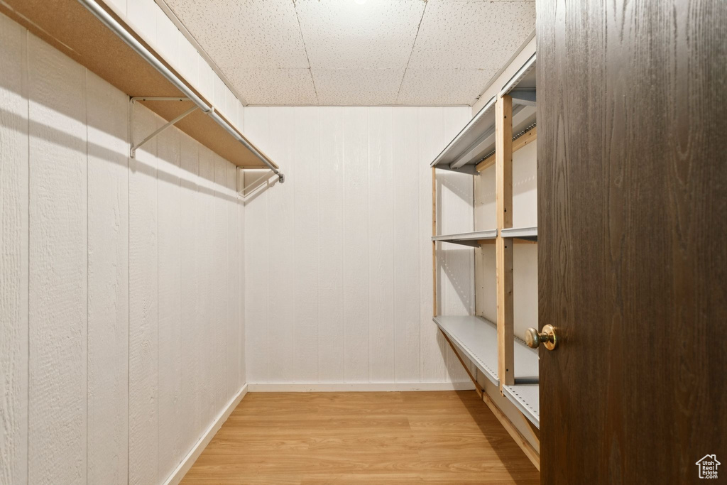 Spacious closet with wood finished floors
