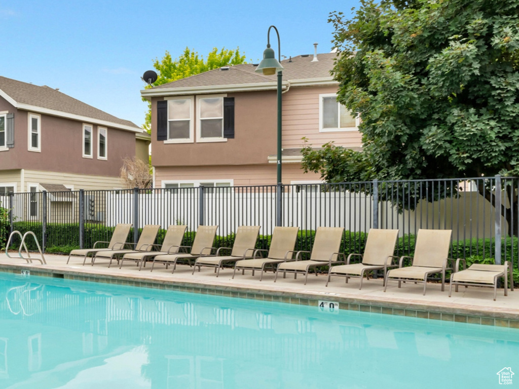 Community pool featuring a patio area
