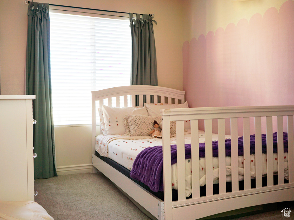 Carpeted bedroom with baseboards