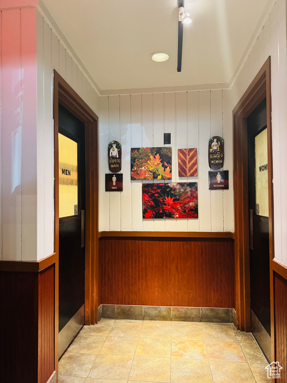 Hallway with wood walls and wainscoting