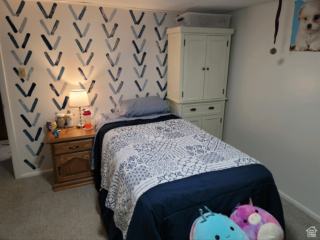 Carpeted bedroom with baseboards