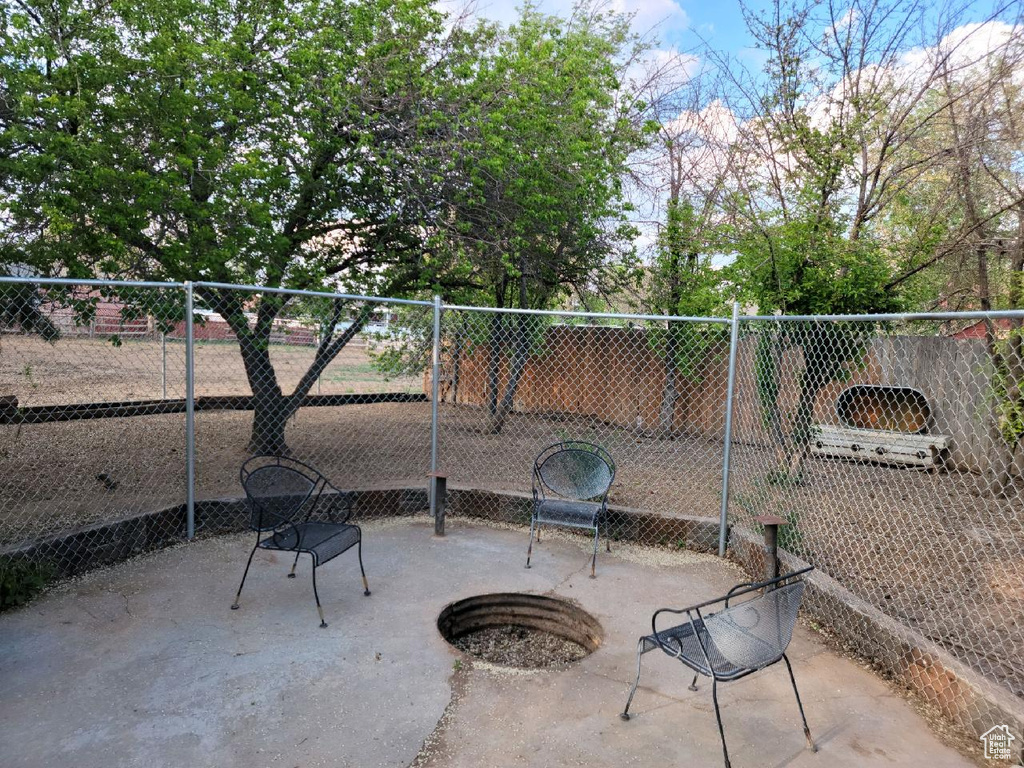 Fenced backyard featuring a patio