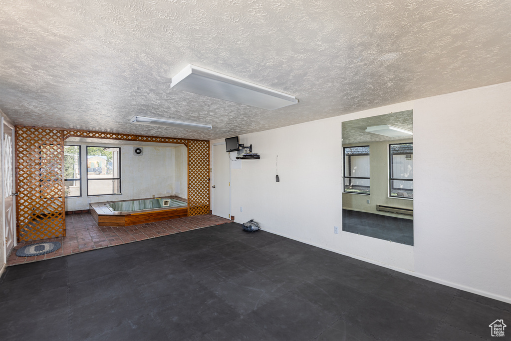 View of patio with a baseboard heating unit