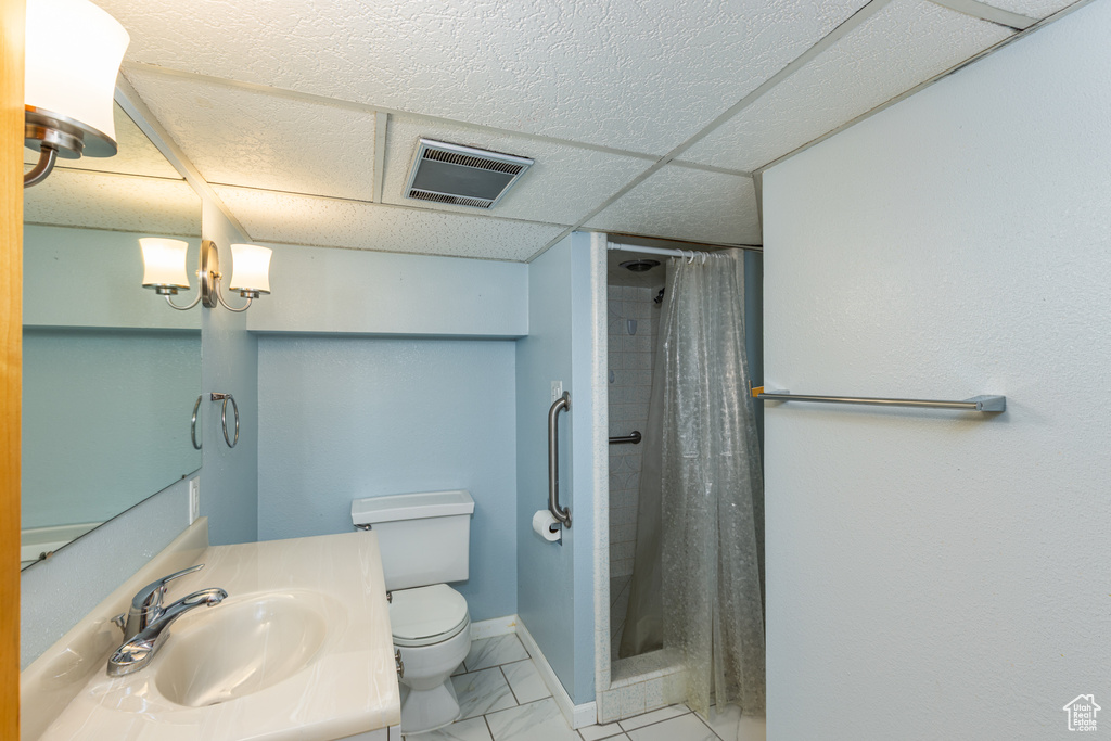 Bathroom with vanity and a shower stall