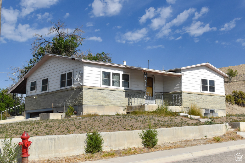 View of front of property with stone siding