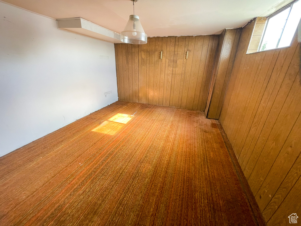 Empty room featuring wooden walls