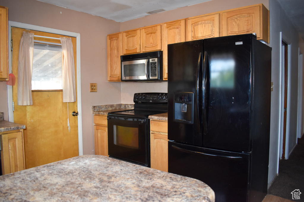 Kitchen with black appliances