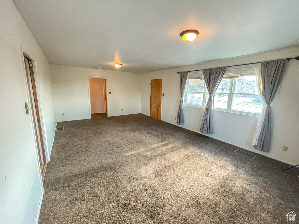 Empty room featuring carpet flooring