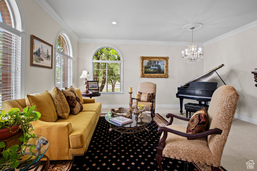 Living area featuring a chandelier, ornamental molding, carpet floors, and recessed lighting