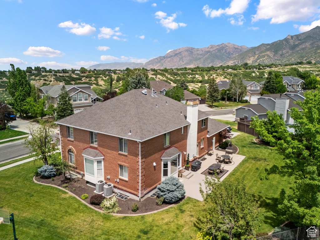 Aerial view of residential area featuring mountains