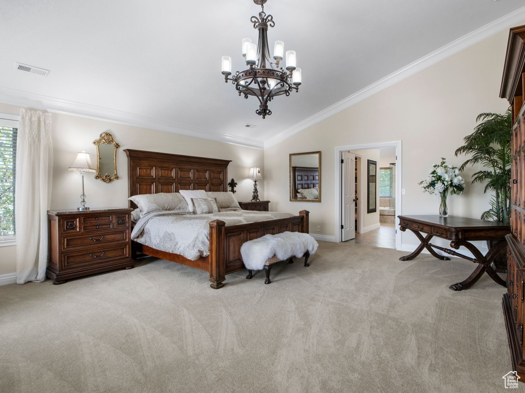 Bedroom featuring a chandelier, light carpet, lofted ceiling, and crown molding