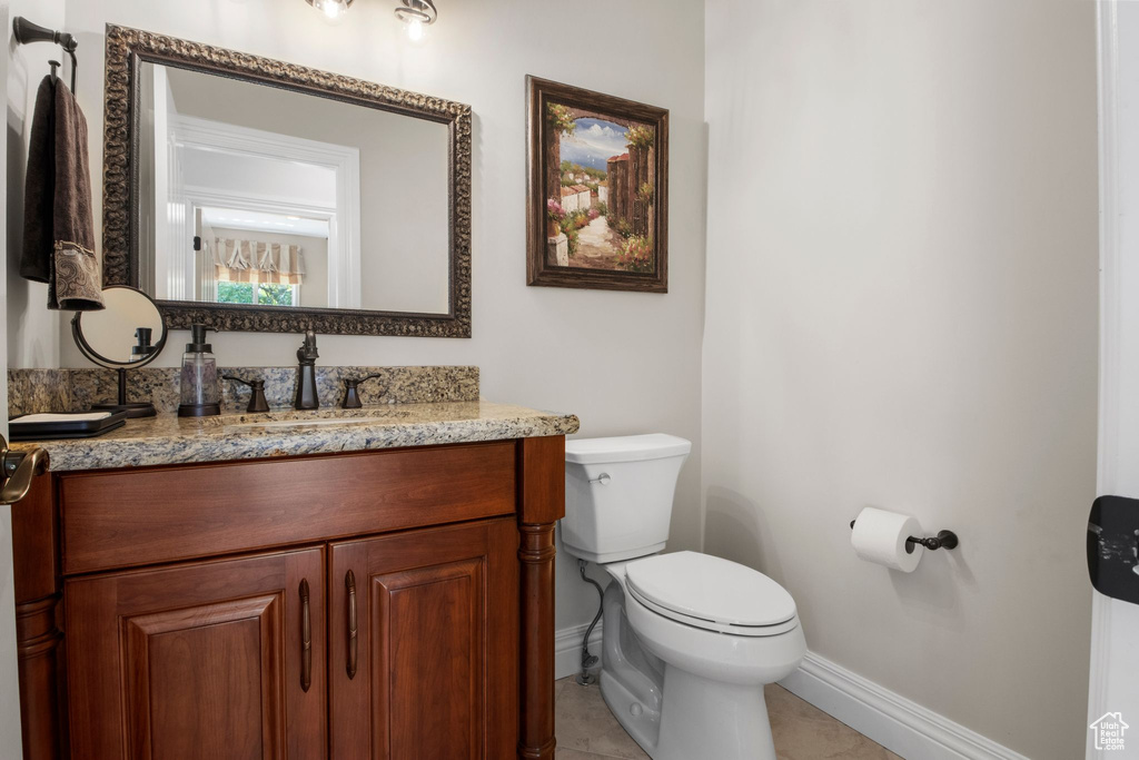 Bathroom featuring vanity and tile patterned floors