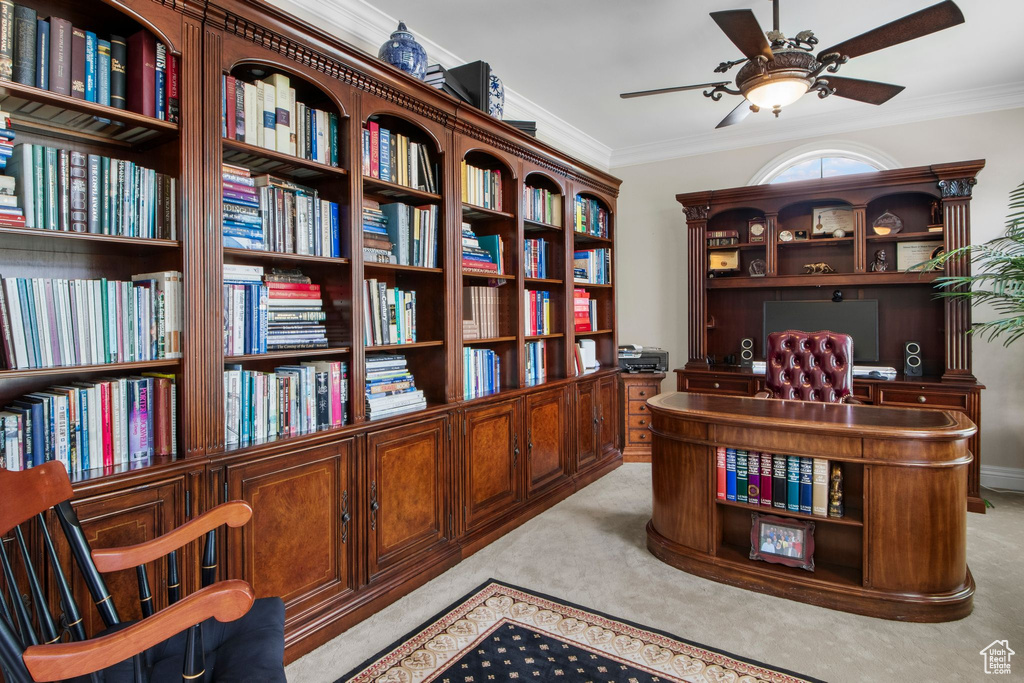 Office space featuring ceiling fan, light carpet, and ornamental molding