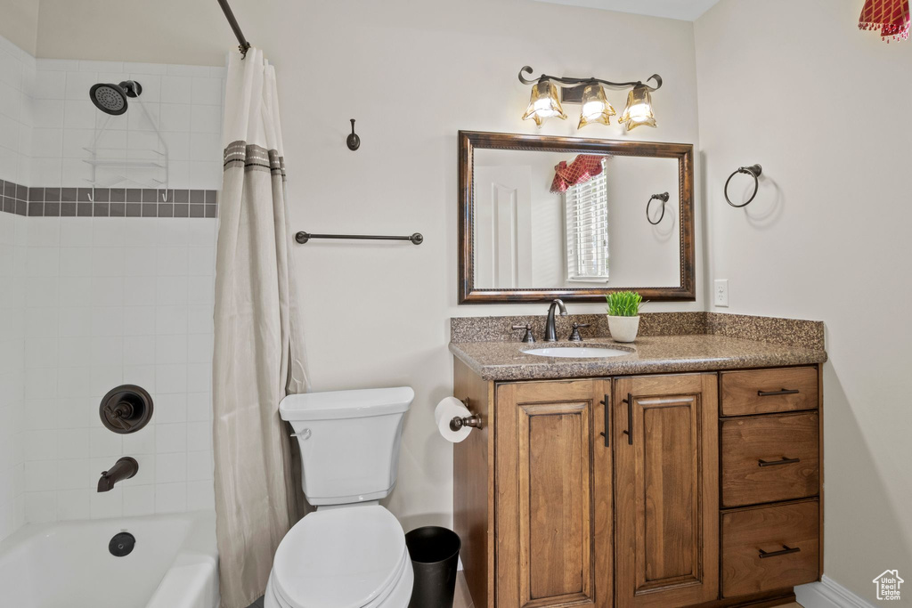 Full bathroom with vanity and shower / bathtub combination with curtain