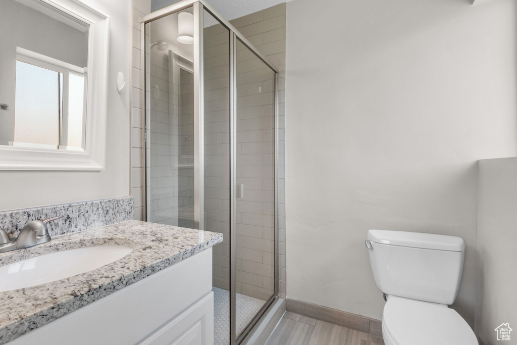 Bathroom with vanity and a stall shower