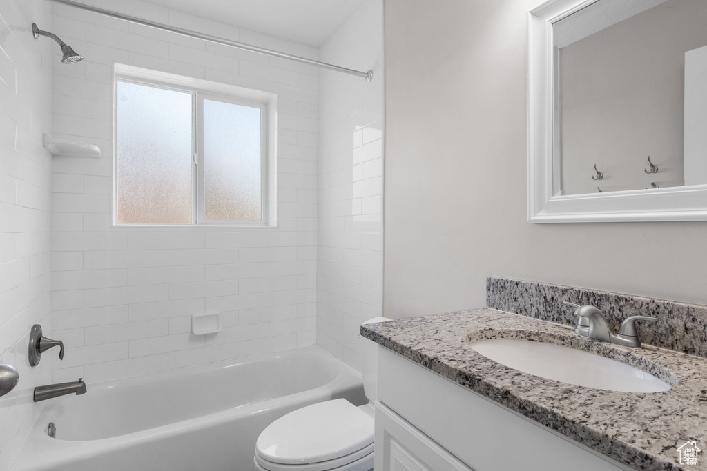 Bathroom with vanity and  shower combination
