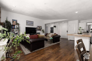 Living area with wood finished floors and recessed lighting